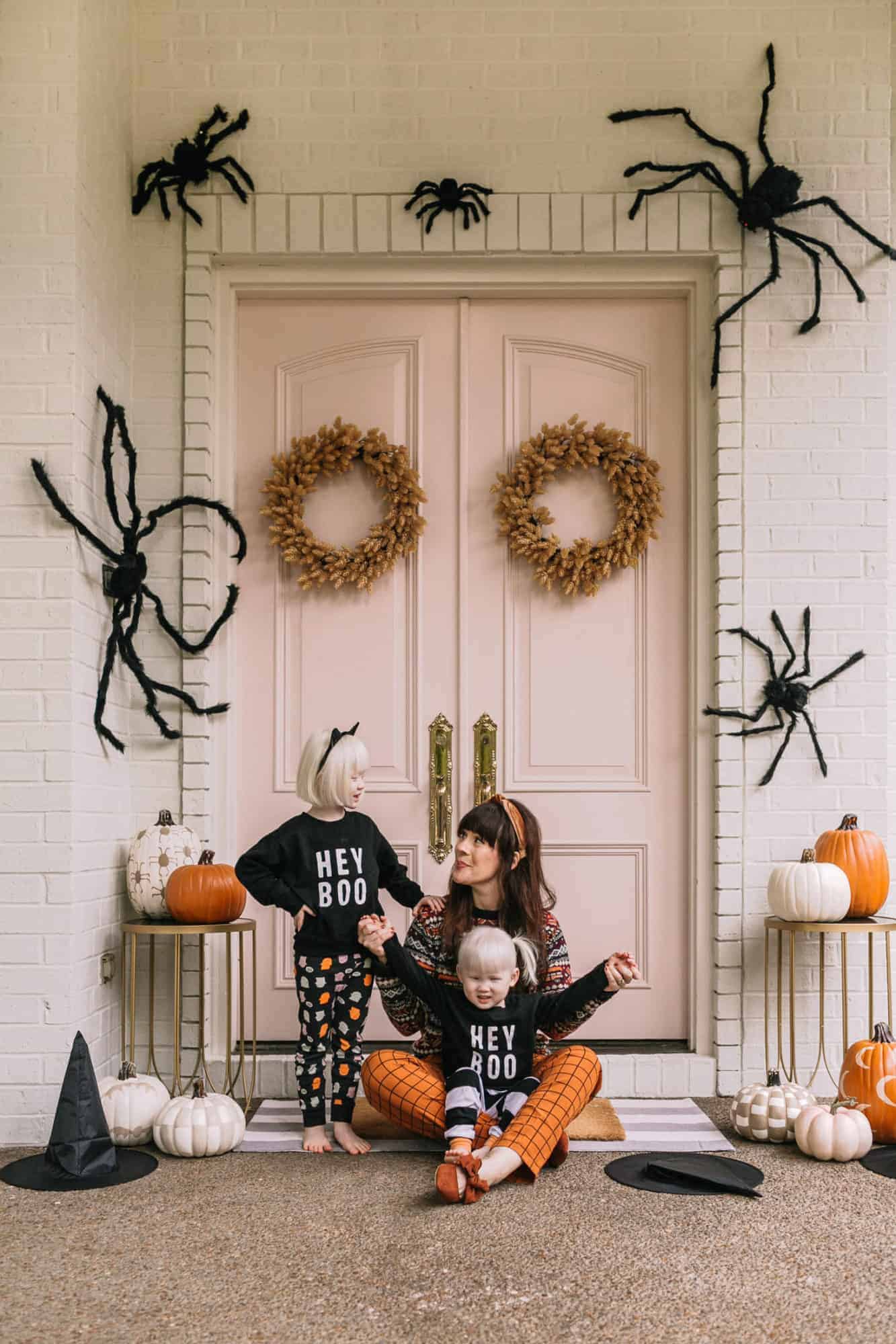 front porch decorated for halloween with spiders and bats